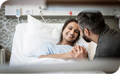 Patient in hospital bed with family 1